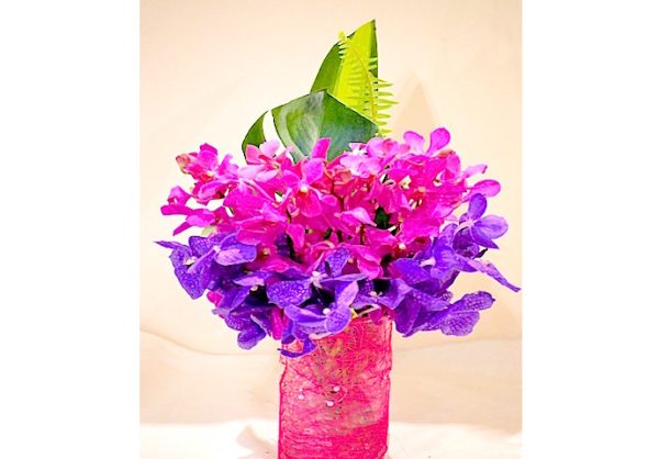 "singapore orchids in decorated glass vase"